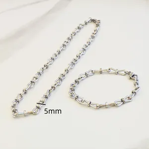Close-up of 5mm wide stainless steel 8-shape bow link necklace and bracelet jewelry set