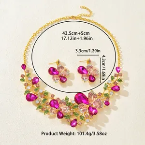 Detail view of vintage butterfly and flower rhinestone necklace and earring set