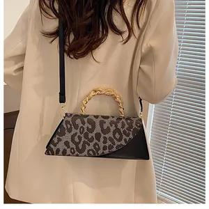 Fashion retro leopard print crossbody bag with gold metal braided handle on model