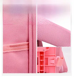 Detailed view of durable pink fabric and mesh straps of a kids' trolley backpack