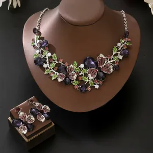 Detailed view of vintage butterfly floral jewelry set with colorful rhinestones
