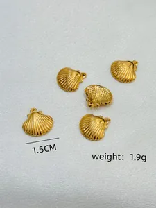 Macro view of gold seashell pendants showing 1.5cm size and 1.9g weight details