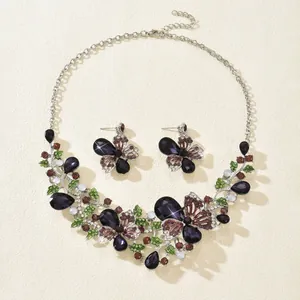 Exquisite detail of vintage butterfly and floral jewelry set with purple rhinestone accents