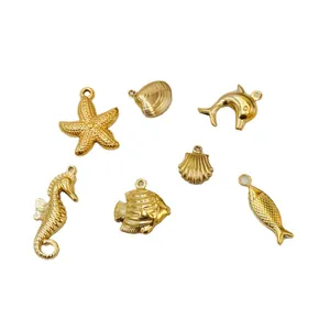 Golden ocean-themed metal pendants including starfish, seahorse, and dolphin charms.