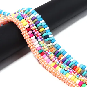 Detail view of multicolored polymer clay wheel spacer beads for DIY jewelry making.