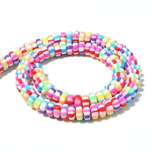 Close-up of multi-color striped polymer clay wheel spacer beads for DIY jewelry making