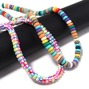 Macro view of colorful striped candy polymer clay disc beads for DIY jewelry making