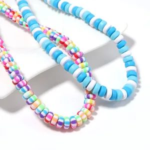 Macro detail of vibrant candy-colored polymer clay heishi beads for DIY jewelry crafting