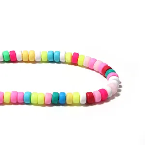 Macro detail of colorful polymer clay wheel spacer beads for DIY jewelry making.