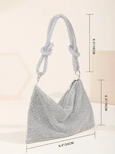 Detailed size measurements for this silver knotted rhinestone evening bag 24cm by 16cm