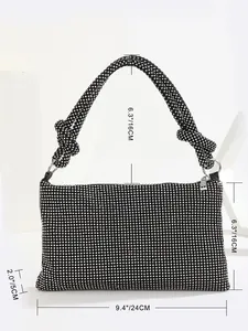 Detailed view of rhinestone evening bag with dimensions 24x16x5cm and knotted strap
