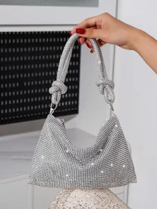 Sparkly silver rhinestone evening bag with knotted handle for parties
