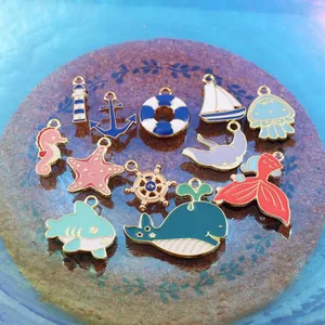Collection of colorful ocean-themed enamel alloy charms including whale and shark for DIY crafts