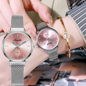 Elegant detailed view of women's quartz watch with pink dial and silver mesh band