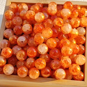 Close-up of 8/10mm orange crackle glass beads with gold foil speckles for DIY jewelry