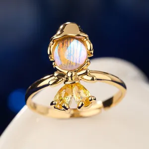 Macro detail of fairy tale princess ring featuring moonstone and yellow zirconia