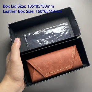 Detailed macro view of brown leather sunglasses case inside protective black gift box