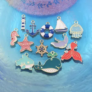 Detail view of colorful marine enamel charms for DIY jewelry making with gold finish