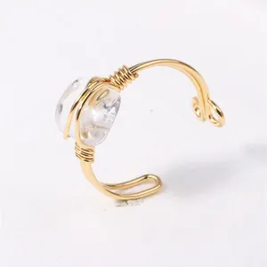 Elegant handmade wire wrapped ring featuring a natural clear crystal stone shard.