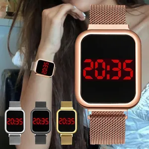 Detailed view of rose gold digital watch with Milanese magnetic strap on wrist