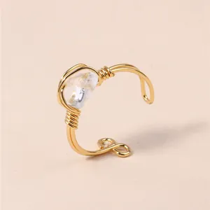 Handmade wire wrapped gold ring with a natural clear quartz crystal for women jewelry.