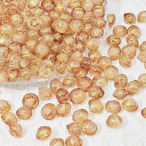 Macro view of 8x10mm amber glass UFO beads with gold foil texture for DIY jewelry