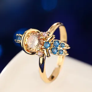 Close-up macro view of a gold fairy tale princess ring set with colorful gemstones.
