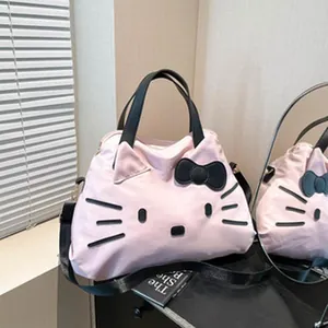 Detailed view of pink large capacity tote bag with Hello Kitty cat face design elements