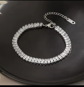 Detailed view of silver stainless steel bracelet featuring baguette-cut cubic zirconia stones
