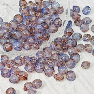 Close-up macro view of 8x10mm leopard print glass saucer beads for DIY jewelry making