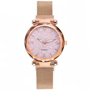 Detail of women's quartz watch with starry pink dial and rose gold Milanese strap