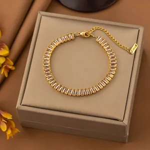 Gold stainless steel bracelet featuring sparkling baguette-cut cubic zirconia stones
