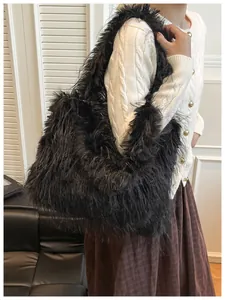 Close-up of a black oversized shaggy faux fur shoulder bag worn with casual outfit.