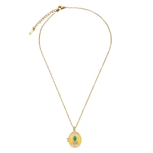 Vintage gold stainless steel locket necklace with green gemstone and enamel detail