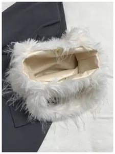 Detailed interior view of a white fluffy shoulder bag featuring magnetic clasp and soft lining