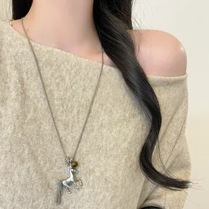 Luxury metal horse pendant necklace for women with a long stylish sweater chain