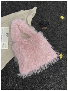 Stylish pink furry plush shoulder bag shown in an aesthetic outdoor autumn setting