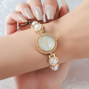 Elegant women's gold quartz watch with pearl bracelet strap for fashion accessory