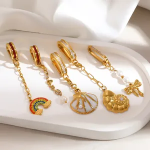 Exquisite detail view of gold-plated stainless steel charms featuring pearls and crystals