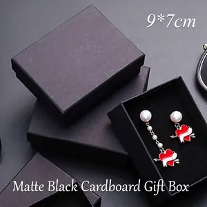 Close-up of minimalist black cardboard jewelry boxes with 9x7cm dimensions