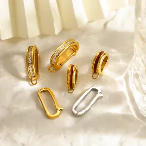 Detailed macro view of gold and silver plated stainless steel jewelry clasps with rhinestone inlays