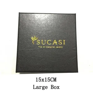 Detail view of a large 15x15cm black jewelry packaging box featuring a gold logo