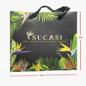 Detailed view of the tropical floral jewelry gift bag with 18x16cm dimensions marked