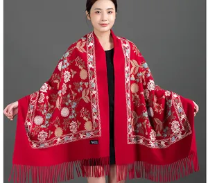 Elegant red winter scarf with floral embroidery and fringe details