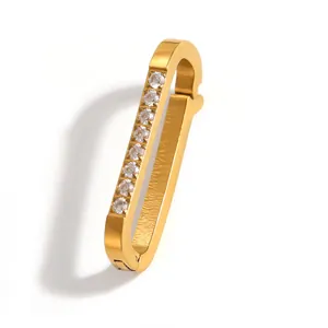 Close-up detail of a gold-plated stainless steel buckle with inlaid sparkling crystals