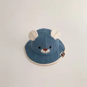 Adorable baby blue bucket hat with cute bear ears and embroidered face detail