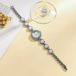 Elegant silver-toned ladies quartz watch with pearl embellished bracelet strap