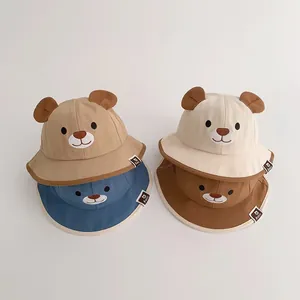 Adorable baby bucket hats featuring bear ears and embroidered faces in multiple colors