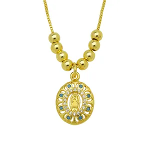 Detail view of 18K gold-plated Virgin Mary oval pendant featuring colorful zircon stones