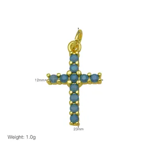 Gold-plated copper cross pendant with blue zircon stones, 23mm x 12mm, weight 1.0g
